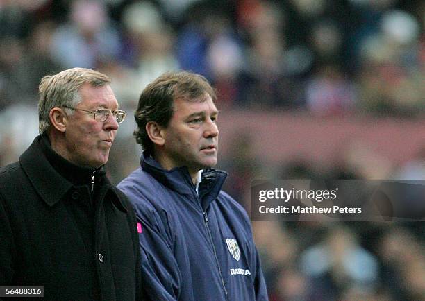 Sir Alex Ferguson of Manchester United and Bryan Robson of West Bromwich Albion watch from the sidelines during the Barclays Premiership match...