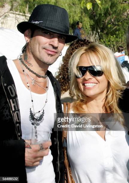 Musician Tommy Lee and actress Pamela Anderson pose at the home of John Paul DeJoria, CEO and co-founder of John Paul Mitchell Haircare Systems,...
