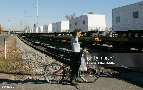 New Orleans resident Vanessa Mossop watches a trainload of FEMA trailers arrive December 26, 2005 in New Orleans, Louisiana. Nearly four months after...