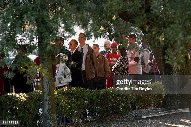 Fans wait in line to pay their respects to James Dungy outside Wilson Funeral Home on December 26, 2005 in Tampa, Florida. More than 1,000 people...