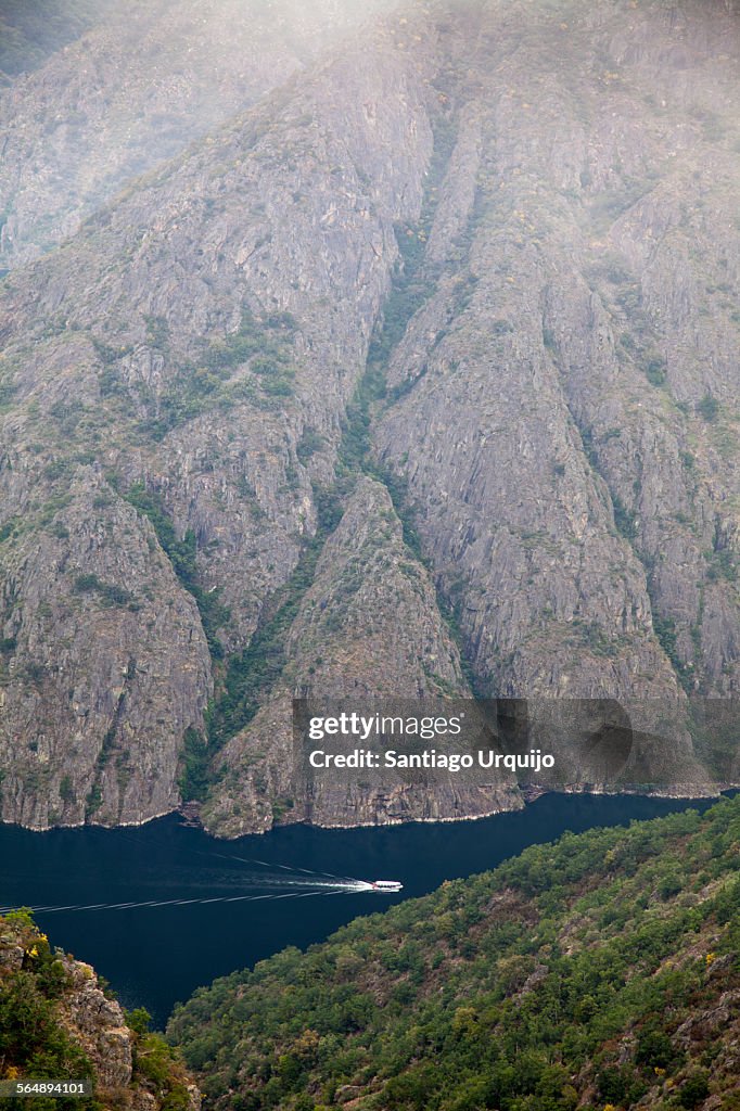 Ferry traversing the Sil River Canyon