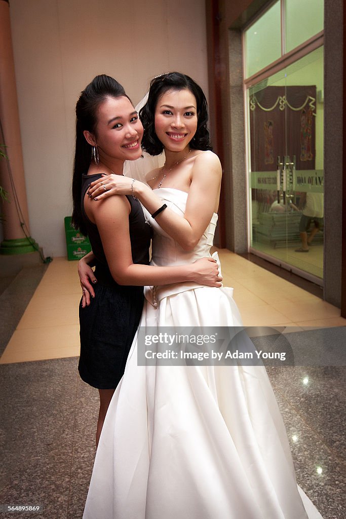 Two Asian girls at a wedding