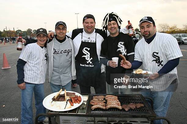 Fans of the Chicago White Sox grill sausages in the parking lot before Game One of the Major League Baseball World Series against the Houston Astros...