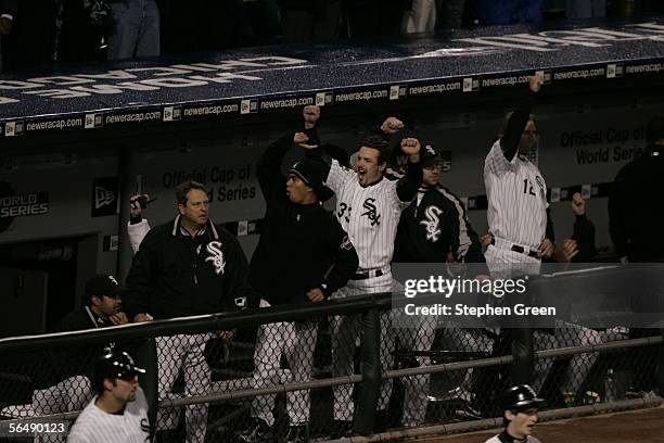 Members of the Chicago White Sox including Aaron Rowand cheer from the dugout during the first inning of Game One of the Major League Baseball World...