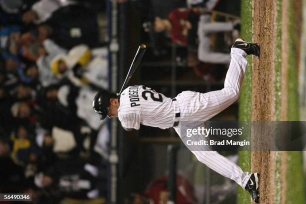 Scott Podsednik of the Chicago White Sox hits a game winning home run off of Brad Lidge during the bottom of the ninth inning of Game Two of the...