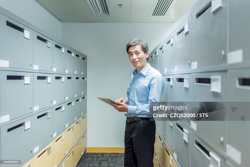 Businessman in document room