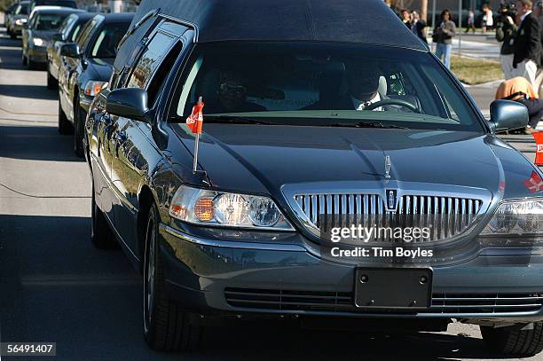 The hearse transporting the body of James Dungy, son of Indiapolis Colts head coach Tony Dungy, leaves the funeral December 27, 2005 in Tampa,...