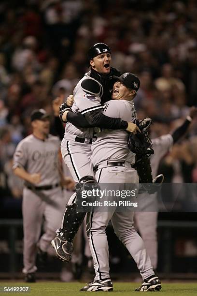 Bobby Jenks and A.J. Pierzynski of the Chicago White Sox celebrate after winning the 2005 World Series in four games against the Houston Astros at...