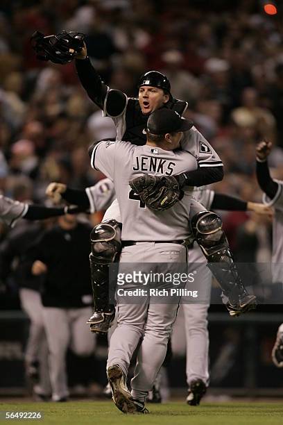 Bobby Jenks and A.J. Pierzynski of the Chicago White Sox celebrate after winning the 2005 World Series in four games against the Houston Astros at...
