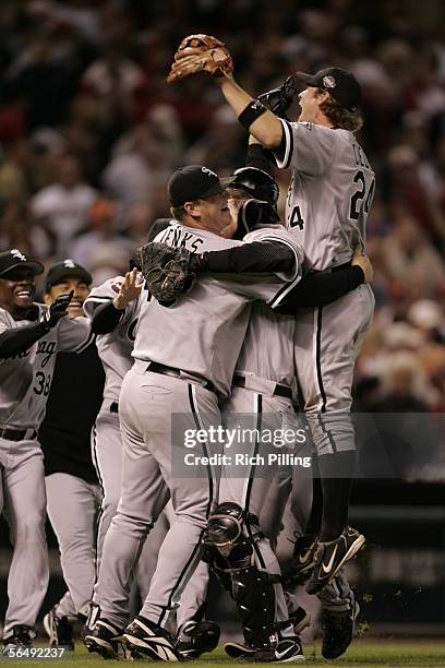 Pierzynski, Bobby Jenks, and Joe Crede of the Chicago White Sox celebrate winning the World Series in four games against the Houston Astros at Minute...