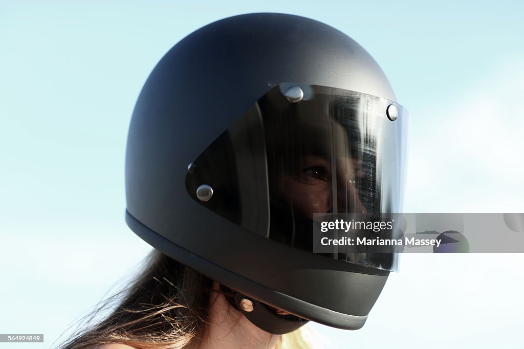 Woman wearing a motorcycle helmet