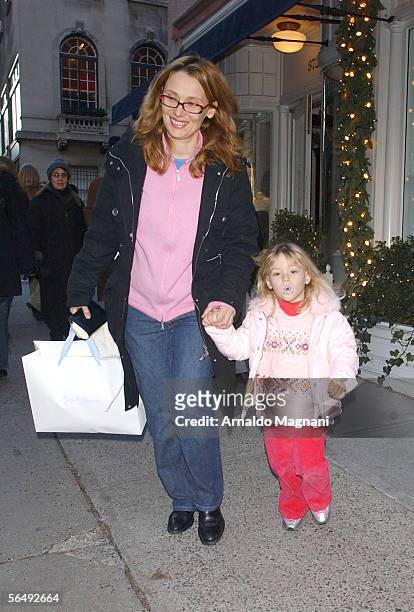 Nicoletta Mantovani-Pavarotti and three-year-old daughter, Alice, walk along Madison Avenue December 27, 2005 in New York City.