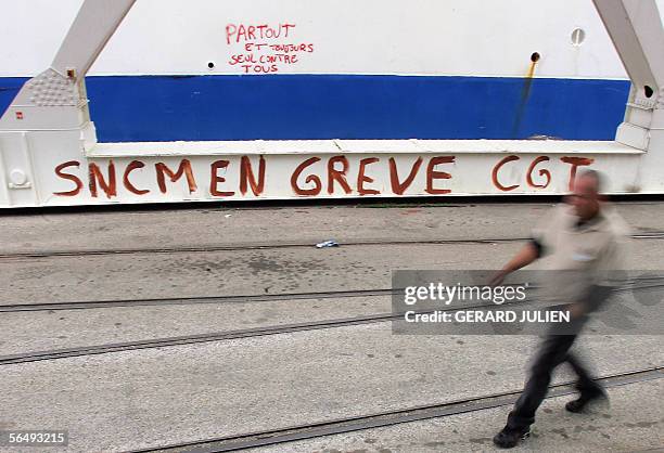 Picture taken 11 October 2005 in Marseille, southern France of National Corsica Mediterranean Company striking seamen walking near a cargo-passenger...