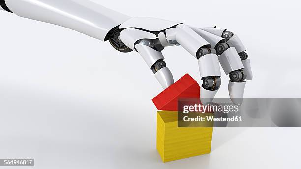 robot building up house with building blocks, 3d rendering - roboter hand stock-grafiken, -clipart, -cartoons und -symbole