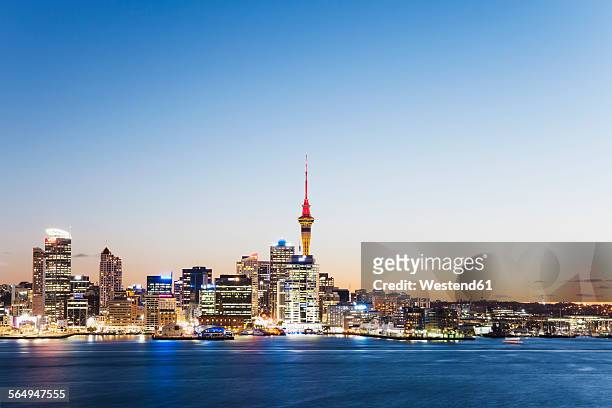 new zealand, auckland, skyline with sky tower, blue hour - auckland skyline stock pictures, royalty-free photos & images