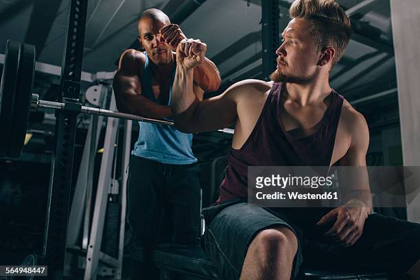 two friends in a gym - hi five gym foto e immagini stock