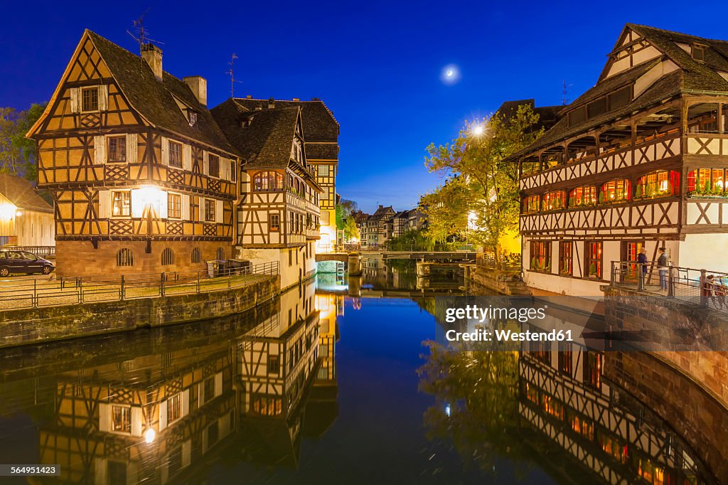 France, Alsace, Strasbourg, La Petite France, half-timbered houses, L'Ill river at night