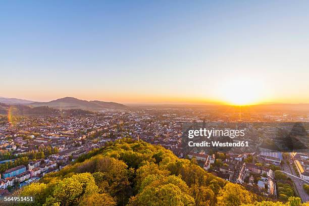 germany, baden-wuerttemberg, freiburg, city view at sunset - freiburg im breisgau stock-fotos und bilder