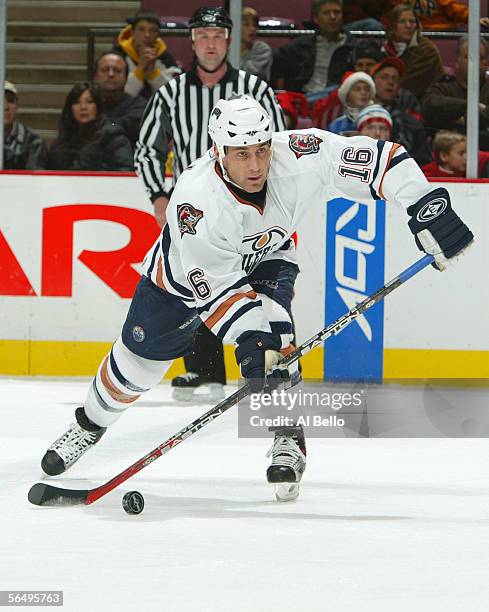 Jarret Stoll of the Edmonton Oilers passes the puck during the game against the New Jersey Devils on December 13, 2005 at the Continental Airlines...