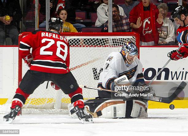 Defenseman Brian Rafalski of the New Jersey Devils waits for a rebound after goalie Olie Kolzig of the Washintgon Capitals made a stick save during...