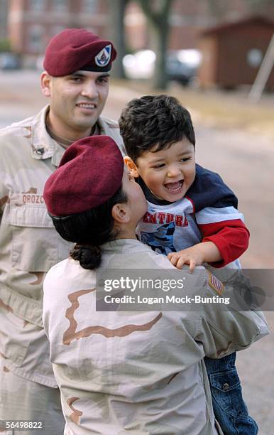 Staff Sergeant Angelina Orozco, who returned home about eight months ago, plays with her son, Gideon, 19 months, while waiting for her husband Staff...