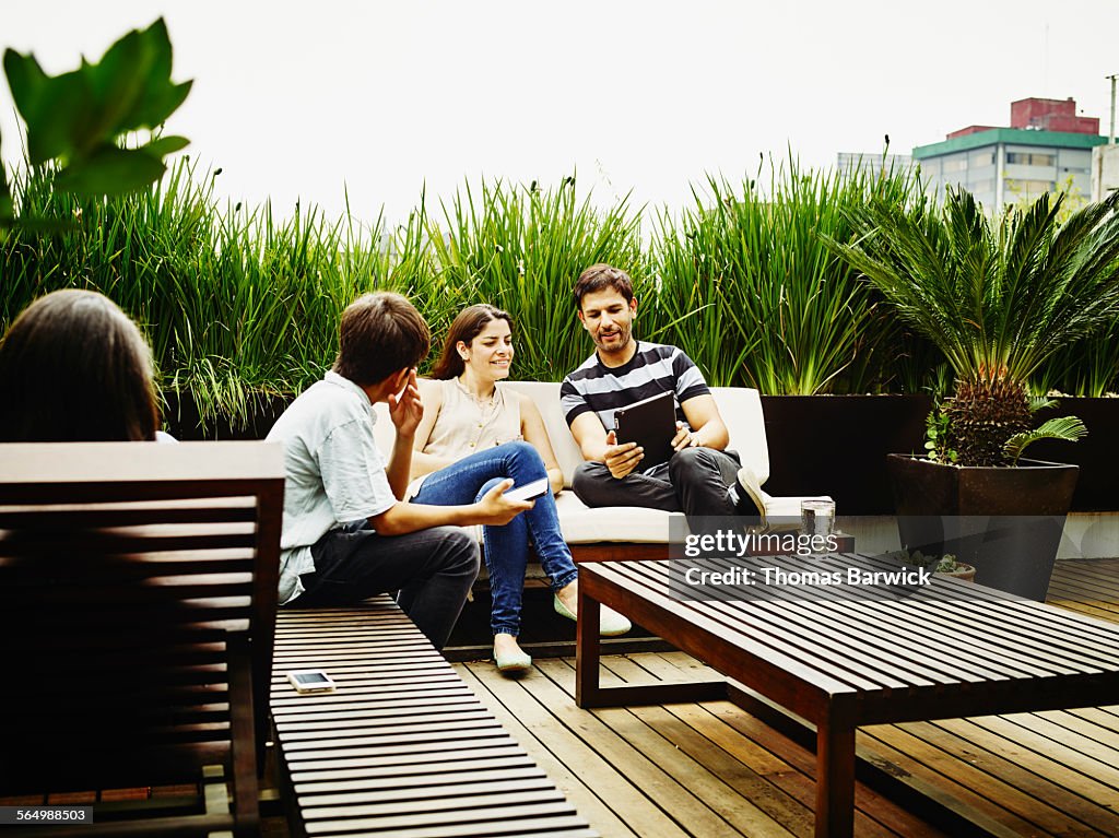 Mother and father looking at digital tablet