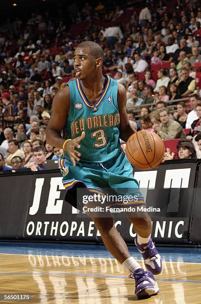 Chris Paul of the New Orleans/Oklahoma City Hornets dribbles against the Orlando Magic during a game at TD Waterhouse Centre on November 19, 2005 in...