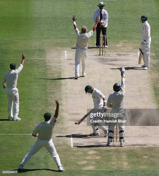 Shane Warne of Australia leads his team mates in an unsuccessful appeal to Umpire Asad Rauf against Ashwell Prince of South Africa during day five of...