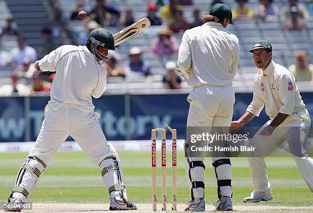 Makhaya Ntini of South Africa is bowled by Stuart MacGill of Australia as Adam Gilchrist and Ricky Ponting of Australia look on during day five of...