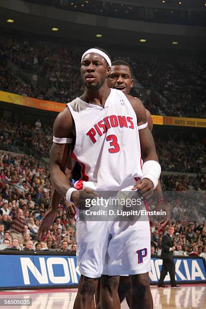 Ben Wallace and Antonio McDyess of the Detroit Pistons celebrate a basket against the Miami Heat in a game on December 29, 2005 at the Palace of...