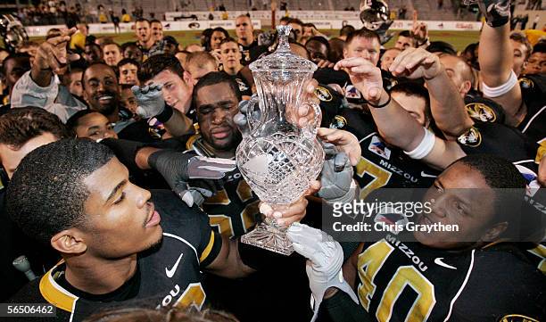 Members of the Missouri Tigers football team celebrate their 38-31 win over South Carolina Gamecocks in the Independence Bowl on December 30, 2005 at...