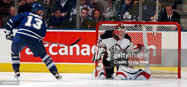 Mats Sundin of the Toronto Maple Leafs scores in the shoot out on Martin Biron of the Buffalo Sabres during the NHL game at Air Canada Centre...