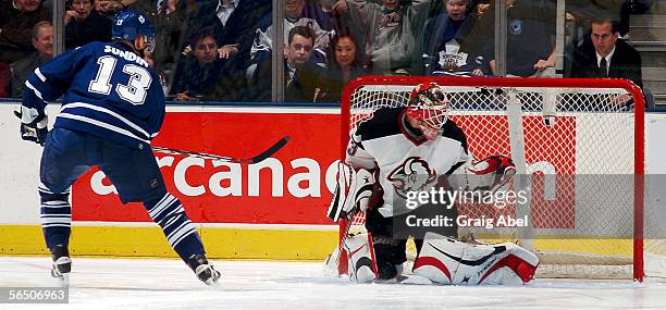 Mats Sundin of the Toronto Maple Leafs scores in the shoot out on Martin Biron of the Buffalo Sabres during the NHL game at Air Canada Centre...