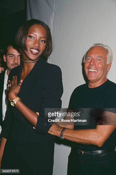 English model, Naomi Campbell and Italian fashion designer, Giorgio Armani, at a private party, circa 1996.