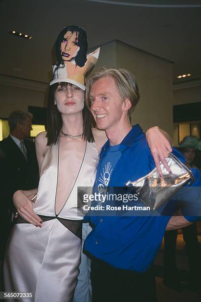 Irish hat designer Philip Treacy with English model Erin O'Connor at a reception to honour Treacy at the Bergdorf Goodman department store, New York...