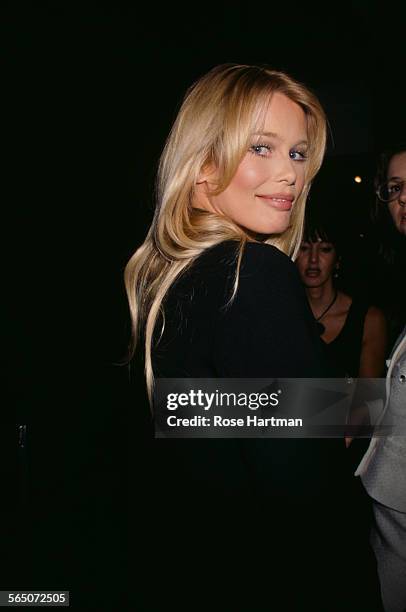 German model Claudia Schiffer attends the preview of the Karl Lagerfeld exhibition 'Visages et Paysages', circa 1995.