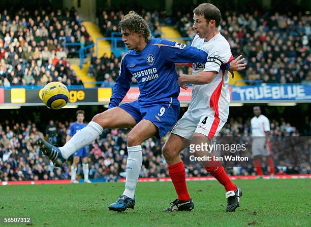 Hernan Crespo of Chelsea battles with Kenny Cunningham of Birmingham City for the ball during the Barclays Premiership match between Chelsea and...