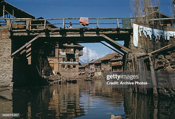 Wooden bridge in a town in Kashmir, circa 1965.