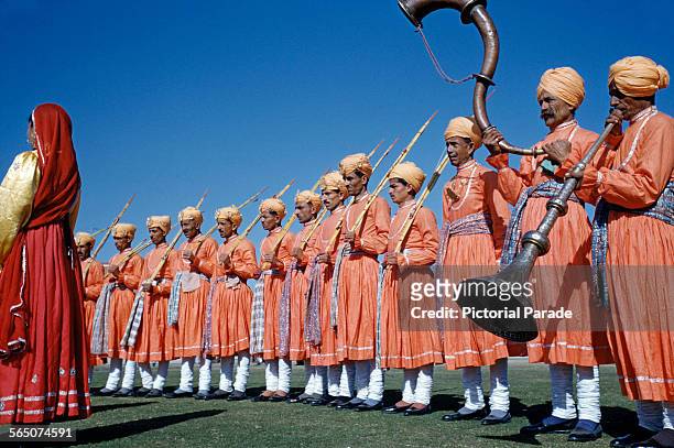 Musicians playing the ranasringa or serpentine horn at a festival in India, circa 1965.