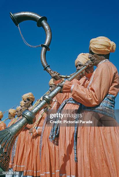 Musicians playing the ranasringa or serpentine horn during the Republic Day celebrations in India, circa 1965.