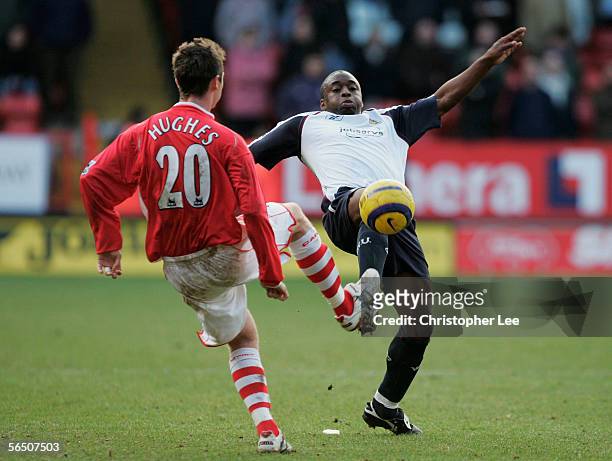 Shaun Newton of West Ham United tackles Bryan Hughes of Charlton Athletic during the Barclays Premiership match between Charlton Athletic and West...
