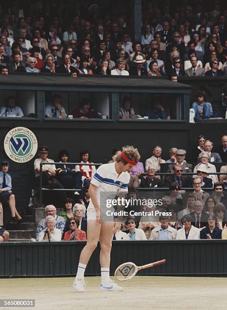 John McEnroe of the United States drops his raquet during the Men's Singles Final match against Bjorn Borg at the Wimbledon Lawn Tennis Championship...