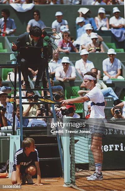 John McEnroe of the United States argues a point with the umpire during the Men's Singles Semi Final match at the French Open Tennis Championship on...
