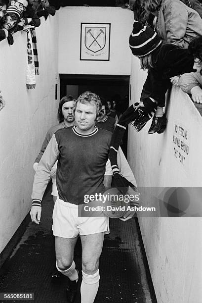 English footballer Bobby Moore leads the West Ham reserves onto the pitch before a match against Plymouth Argyle reserves at West Ham's Boleyn Ground...