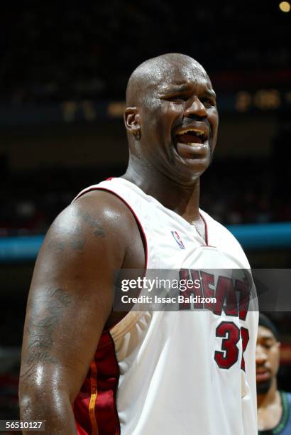 Shaquille O'Neal of the Miami Heat argues a call by the official while playing against the Minnesota Timberwolves on January 1, 2006 at American...