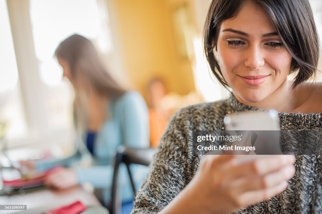 A woman checking her smart phone.