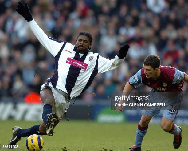 West Bromwich, UNITED KINGDOM: West Bromwich Albion's Nwankwo Kanu vies with Aston Villa's Craig Gardner, during their English Premiership match at...