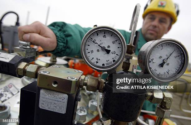 Hungarian regional controller Gyoergy Kallo opens a gas cock as eximines the pressure in the pipe at the main base of the bigest Hungarian gas...