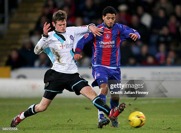 Jobi McNuff of Palace is tackled by Richard Stearman of Leicester during the Coca-Cola Championship match between Crystal Palace and Leicester City...