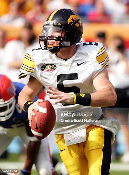 Drew Tate of the Iowa Hawkeyes looks upfield to pass against the Florida Gators during the Outback Bowl on January 2, 2006 at Raymond James Stadium...
